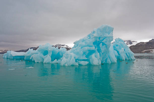 Landscape with icebergs and a wonderful sky with strange clouds in the Disko Bay area in Ilulissat, Greenland