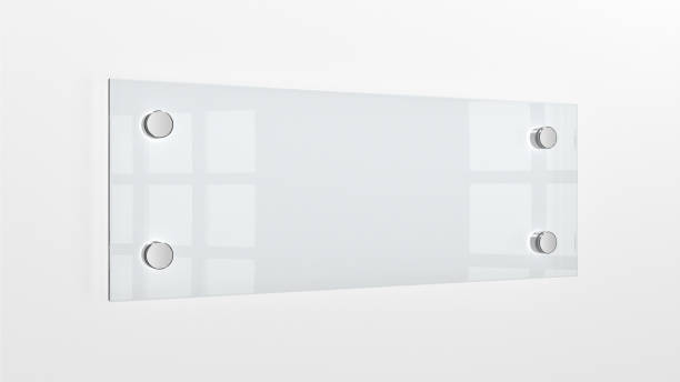 istock Closeup of wall-mounted blank glass nameplate. 1451909492
