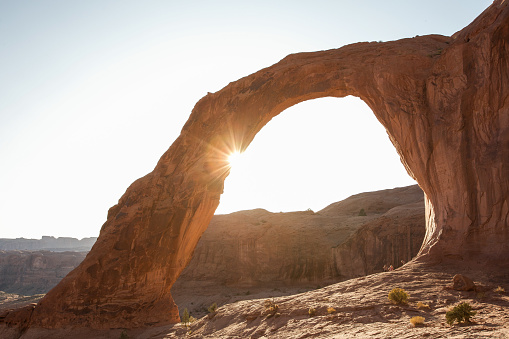 Spending a solitary evening watching sunset over Corona Arch castling the last rays of light through this iconic natural rock formation.
