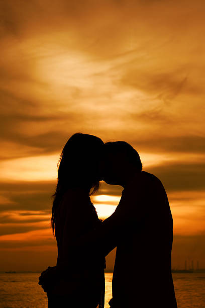 istock Kissing in Silhouette 145191263
