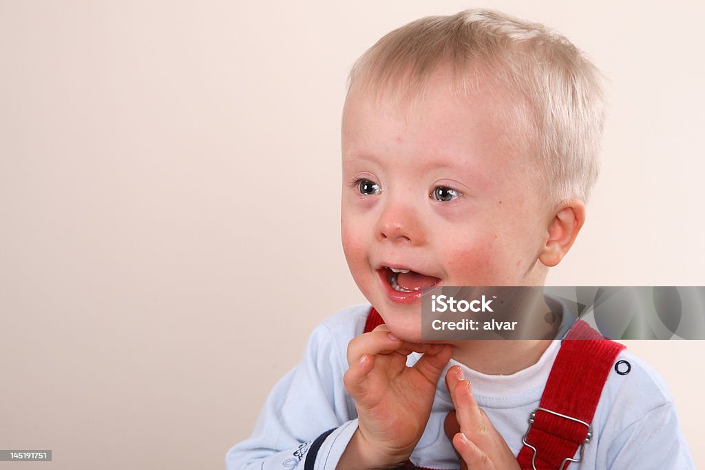 Happy handicapped boy Portrait of a handicapped caucasian happy smiling boy with Down Syndrome. Toddler Stock Photo