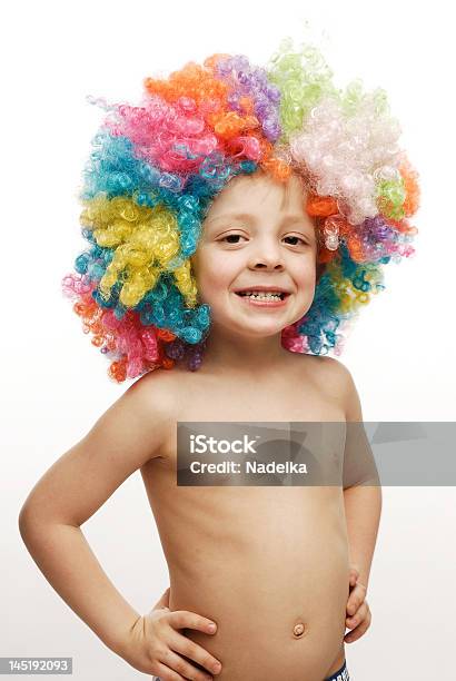 Boy In Colorful Wig Standing His Hands On Hips Stock Photo - Download Image Now - Child, Boys, Human Hair