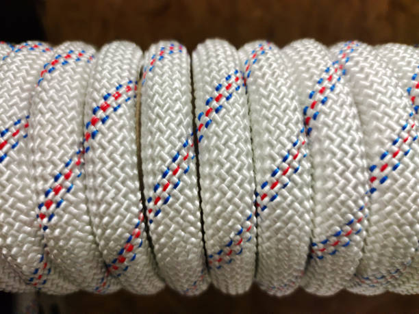 istock A new nylon thick rope is wound on a bobbin. Close up 1451922137