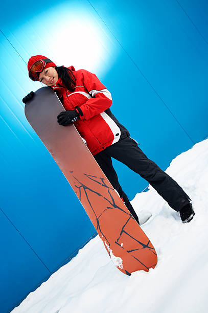 istock young adult female snowboarder 145192647