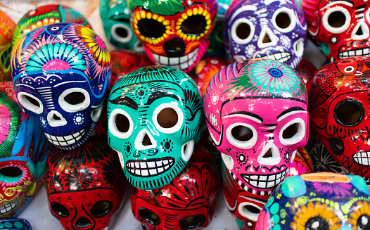 traditional mexican pottery skull ceramics are at sale on the street of touristic places in Oaxaca, Mexico