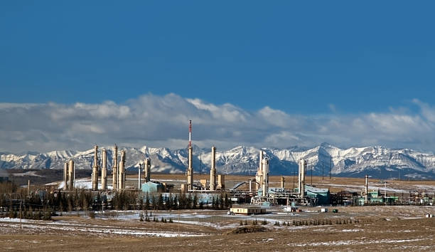 Gas plant near Canadian Rockies Gas plant in Cochrane, Alberta, Canada cochrane alberta photos stock pictures, royalty-free photos & images