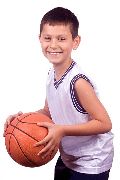 istock Smiling young boy holding his basketball 145193449