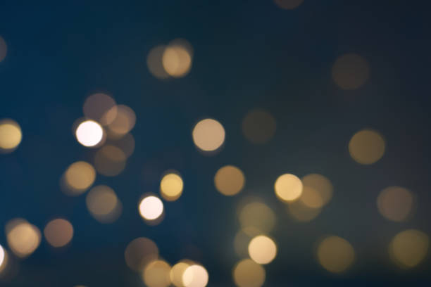 istock Christmas light background. Holiday glowing backdrop. Defocused Background With Blinking light. Blurred Bokeh. 1451937120