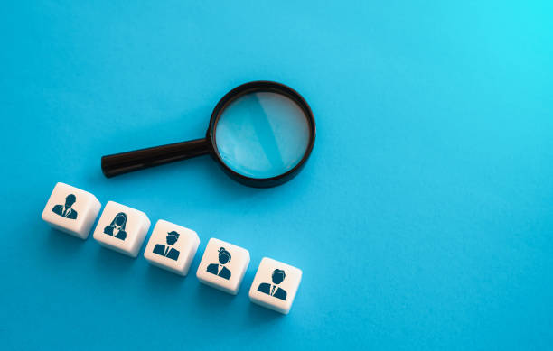 istock Magnifying glass and job candidates. 1451937391