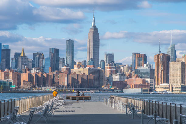 istock NYC skyline in perfect day light with cloudy sky 1451939402