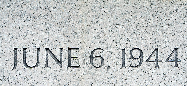 Phrase &quot;June 6, 1944&quot; Carved in Gray Granite, D-Day stock photo