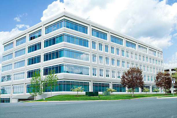A modern white office building in Maryland New office building in suburban Maryland, United States.   - See lightbox for more tree lined driveway stock pictures, royalty-free photos & images