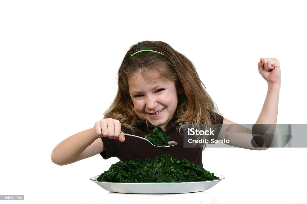 Menina mostrando os músculos da ingestão de Espinafre - Royalty-free Criança Foto de stock
