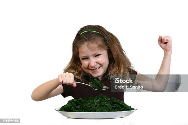 Menina Mostrando Os Músculos Da Ingestão De Espinafre - Fotografias de stock e mais imagens de Criança