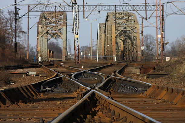 Railroad tracks, with a steel bridges in background stock photo