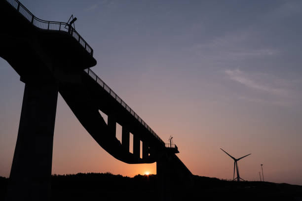 istock morning sun and bridge 1451950500