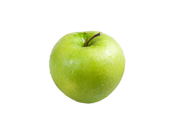 green apple sobre un fondo blanco (aislado - foto de stock