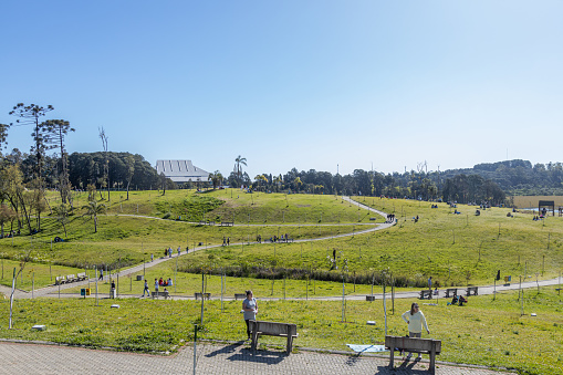 Caxias do Sul, Rio Grande do Sul, Brazil - 24th Sep, 2022 - People walking on pathway and resting in a sunny day at Ecopark (Ecoparque)