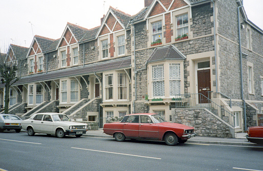 London, England- 1983: A vintage 1980's Nikon negative film scan of a row of traditional English townhouses outside of Bath, England
