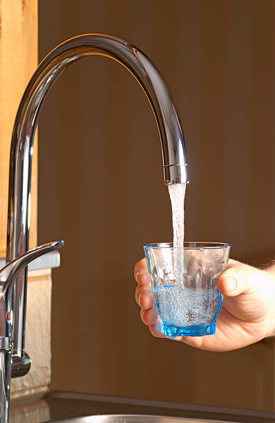 istock Pouring fresh water in a glass 145196269