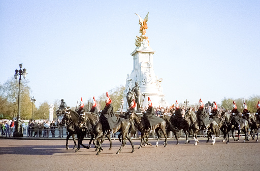 Madrid, Spain - October 27, 2018: Royal guard calming down his disturbed horse during the change of Guard by the Royal Palace of Madrid.