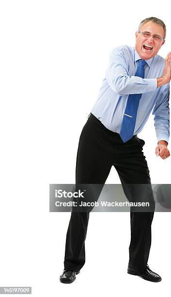 Geschäftsmann Imitating An Der Wand Stockfoto und mehr Bilder von Schieben - Schieben, Wand, Menschen