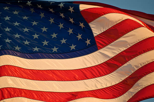 istock American flag blowing in wind 145197415