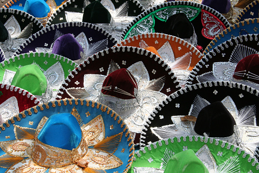 Many multi-coloured Mexican sombreros. 