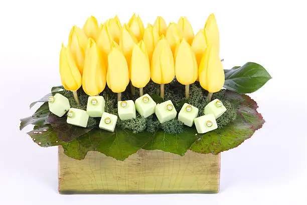 Yellow tulips table decoration in flowerpot