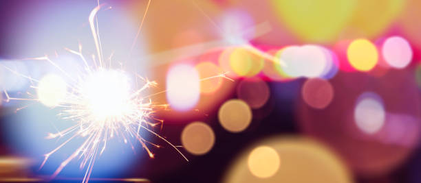 istock Happy New Year background with glowing sparklers. 1451982246