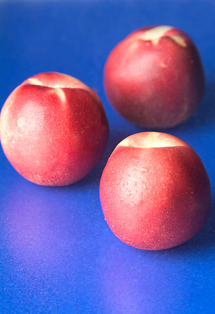 Nectarines on blue