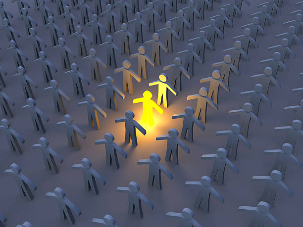 istock Several white people cut outs with one in the center lit up 145198254