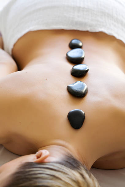 istock Hot stones therapy on a young lady's back 145198307
