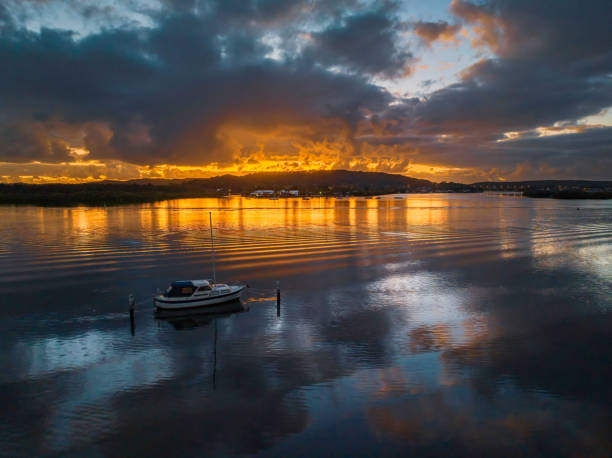 istock Dawn over the bay with clouds and orange highlights 1451990722