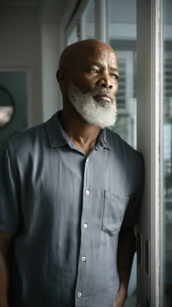 istock Senior man, depression and thinking by window in house or nursing home in lockdown stress, quarantine mental health or lonely. Sad, anxiety and dementia retirement elderly in abandoned burnout crisis 1452002002