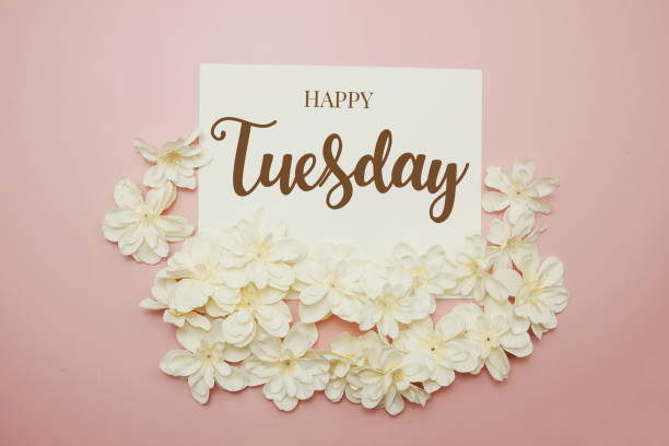 istock Happy Tuesday card typography text with flower bouquet on pink background 1452004902