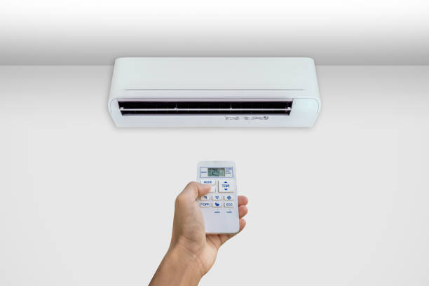 istock Man turning on the air conditioner. 1452006597