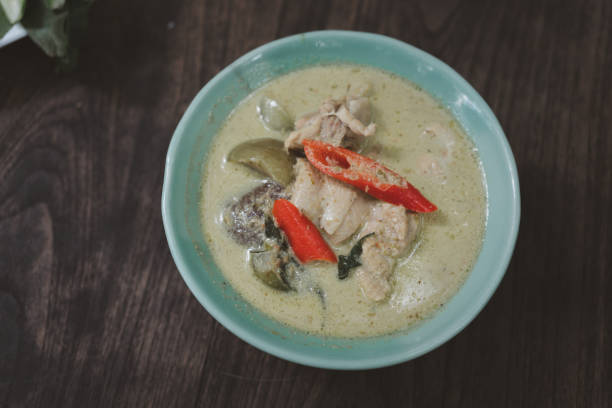 istock Thai food green curry chicken on wood background. 1452010469