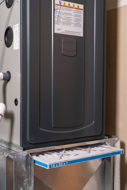 istock Replacing dirty furnace filter in home 1452014438