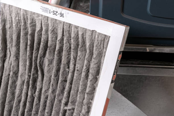istock Replacing dirty furnace filter in home 1452014456