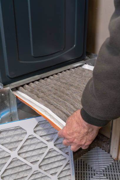 istock Man replacing dirty furnace filter in home 1452014640