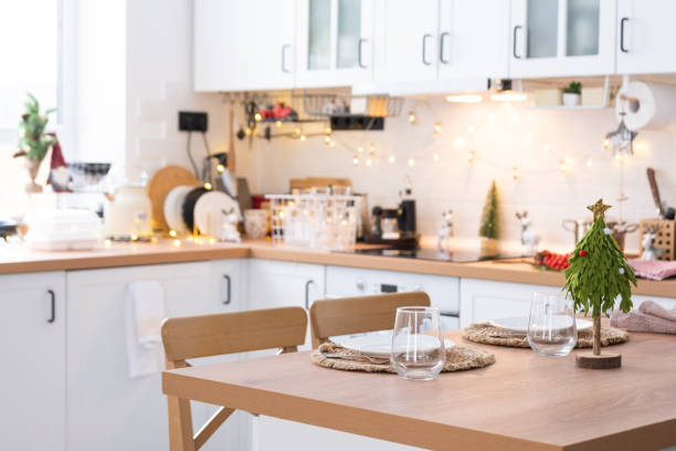 istock Festive Christmas decor and mess in the light kitchen, festive breakfast, white scandi interior. New Year, mood, cozy home 1452014662