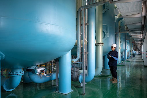 A female engineer works in a chemical plant