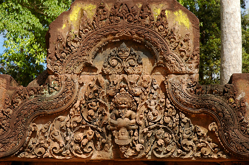 Close up of Lintel and Pediment  narasimha avatara at Banteay Srei or Banteay Srey Pink Sandstone Temple, Siem reap, Cambodia