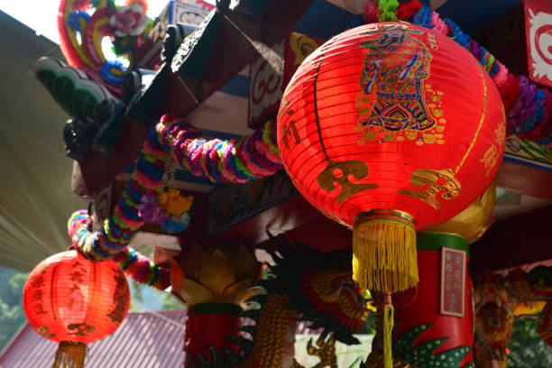 istock Translation of text appear in image is New-Year in chinese language .Pattern chinese lanterns. Chinese lanterns at temple (text on lanterns mean wealth, treasure, prosperous, Longevity ) 1452032566