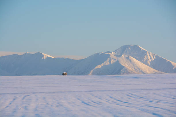 istock Snowfields and snowy mountains at dusk in winter 1452032955