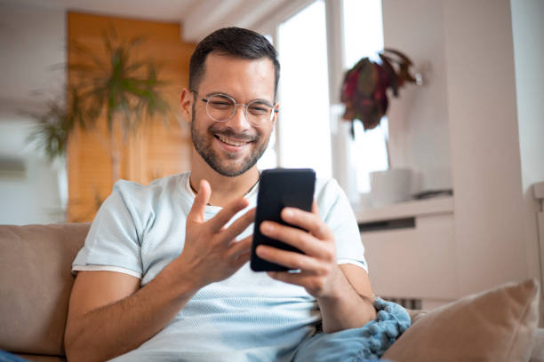 istock Shot of a young man using his smartphone 1452038658