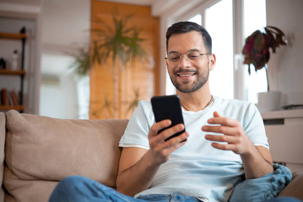 istock Shot of a young man using his smartphone 1452038664