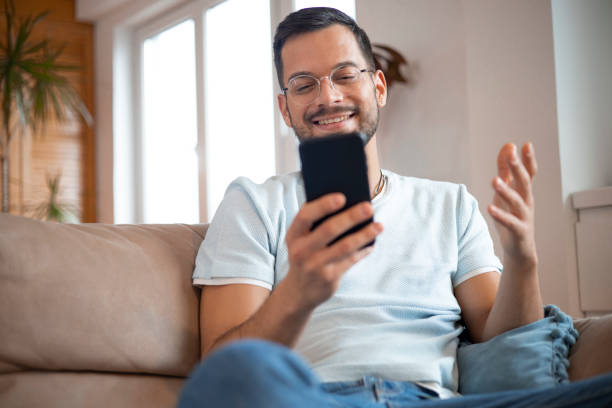 istock Shot of a young man using his smartphone 1452038734