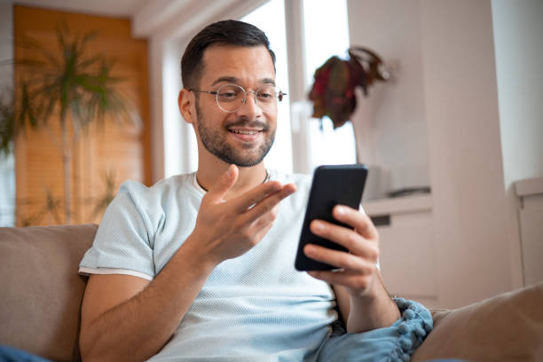 istock Shot of a young man using his smartphone 1452039734